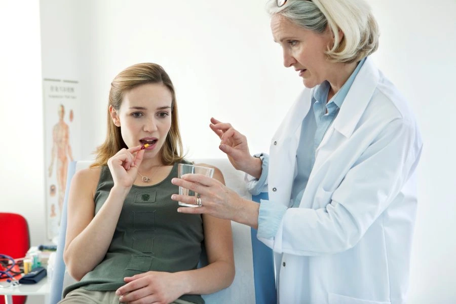 Woman taking a supplement in a study